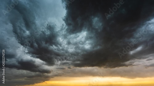 Moody storm clouds rolling overhead in powerful atmospheric time lapse