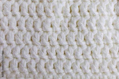 White crochet texture with double crochet stitch pattern close up