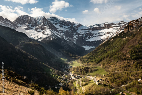 The village of Gavarnie stands below the snow covered Cirque de Gavarnie in the French Pyrenees