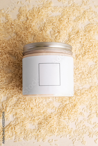 cosmetics, beauty product for skin care, beige bottle of cream, rice flavor