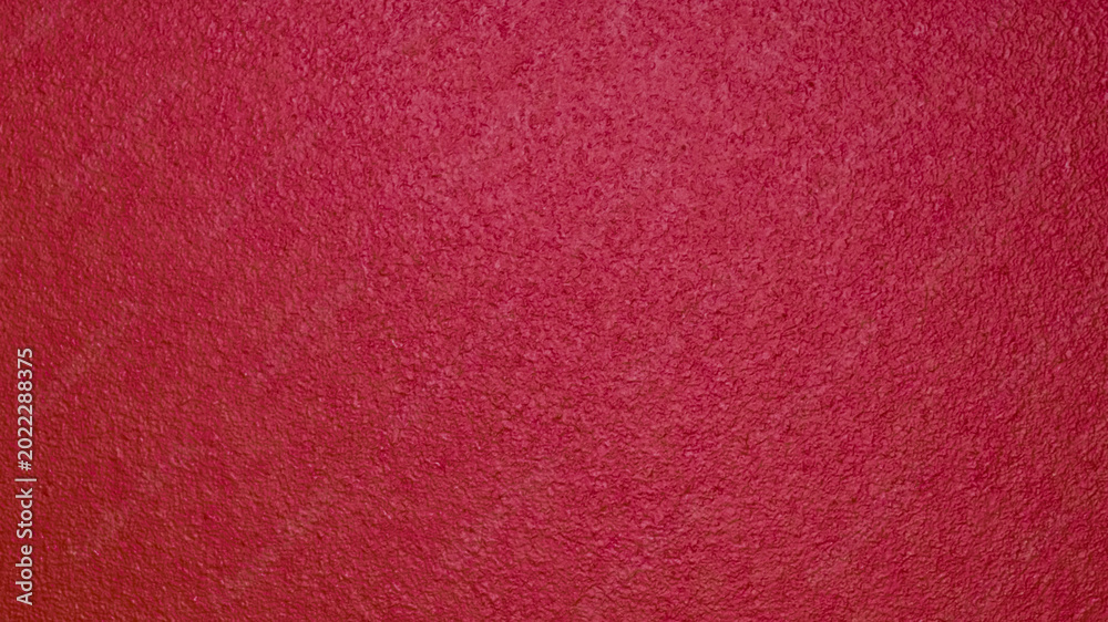 Fototapeta premium Detailed abstract background of a rough wooden surface painted in deep terracotta burgundy color. Textured matte finish of a red timber door