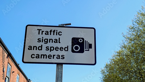 Obraz na plátne Traffic signal and speed cameras sign, UK road warning signboard, enforcement ra