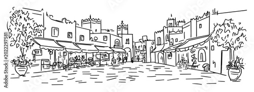 traditional moroccan town square with shops and cafes