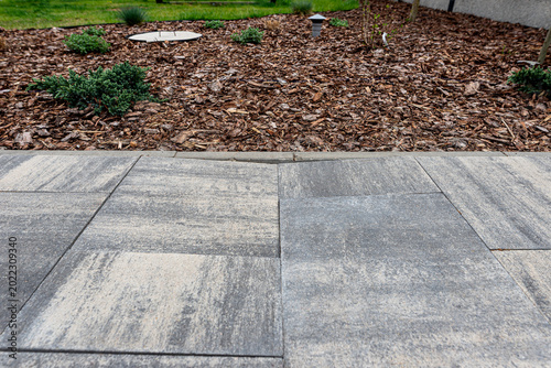Sunken paving slabs on a damaged backyard driveway
