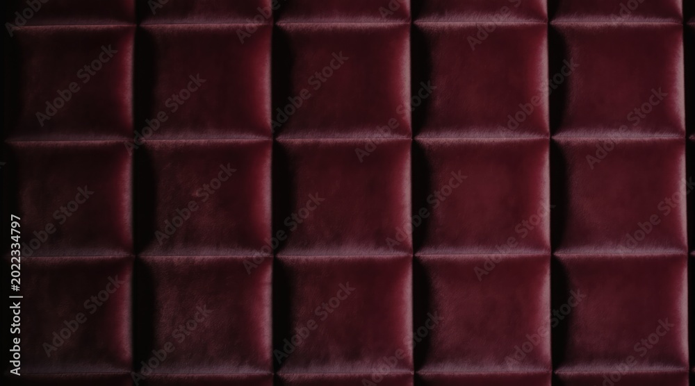 Fototapeta premium Dark red tufted upholstered wall panels create a rich geometric grid pattern. This luxurious background adds depth and texture to interior spaces, suitable for modern or classic decor.