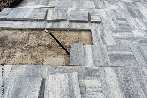 Removing paving stones for driveway repair and renovation