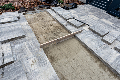 Paving work laying concrete slab patio renovation