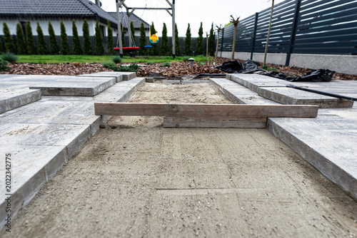 Paving work in progress creating a driveway path