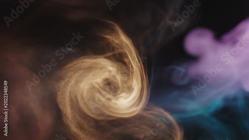 Abstract magenta and orange smoke patterns on black background