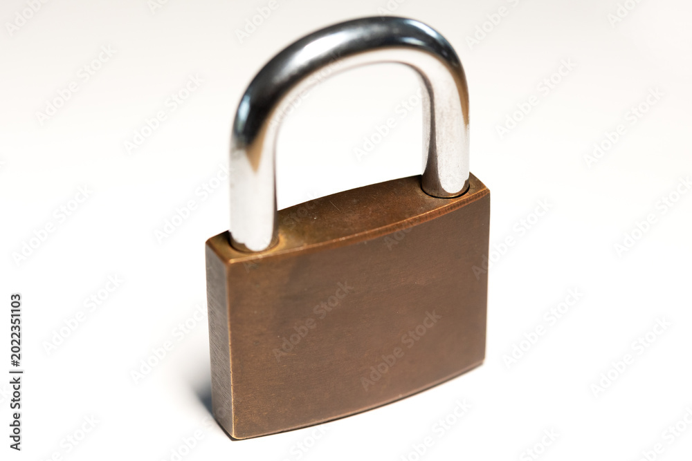 Naklejka premium Close-up locked padlock. Safe, security equipment, privacy, metal. White background.