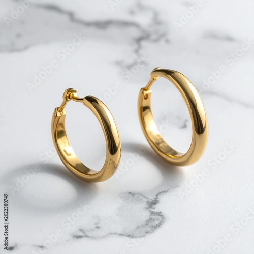 Polished gold hoop earrings closeup