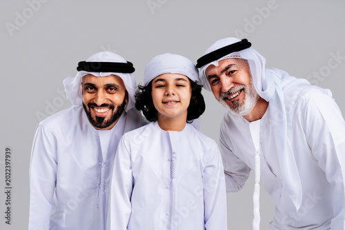 Emirati three generation family posing and smiling together