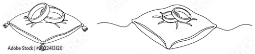 Fotografie Wedding rings placed on ceremonial ring bearer pillow in continuous line art sty