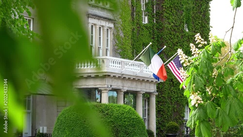 ireland, dublin, irish flag, european union, eu flag, american flag, usa flag, flags, building facade, architecture, elegant building, ivy covered wall, green leaves, historic building, luxury hotel, 