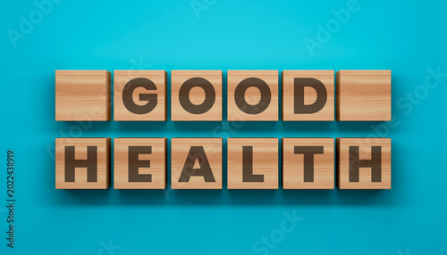 Fotografija Good Health Word Block: Conceptual arrangement of wooden blocks spell out GOOD HEALTH, representing the core of well-being on a vibrant backdrop