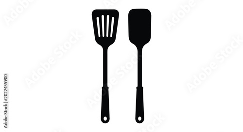 Tableau sur toile kitchen utensils silhouette spatula and slotted spoon on white