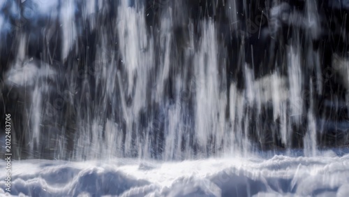 Abstract winter snow falling in forest with blurred background and white snow drifts
