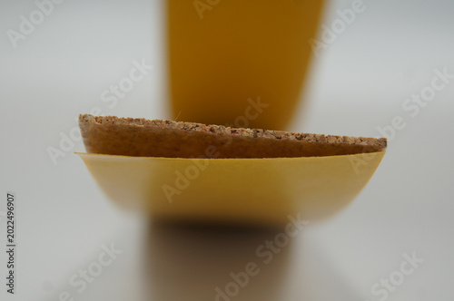 Photography A close view shows a curved cork sheet with a yellow backing layer