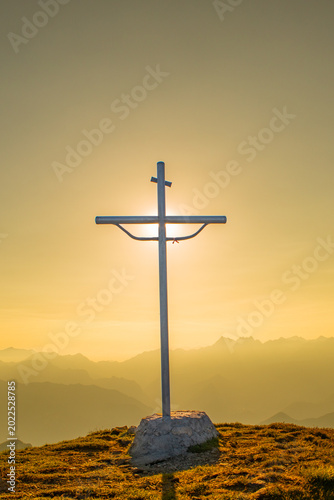 Metal cross on the mountain top