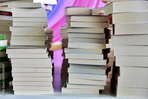 close up view of unrecognizables books arranged in rows