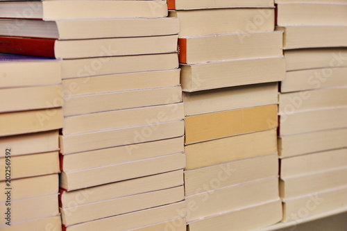 close up view of unrecognizables books arranged in rows