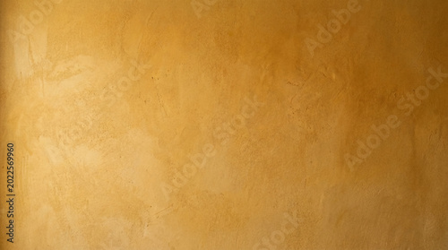 Cuadro en lienzo Textured golden wall, abstract stucco background