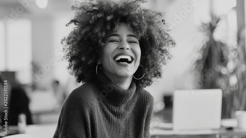 Candid close up of woman laughing during office teamwork meeting, realistic corporate mood