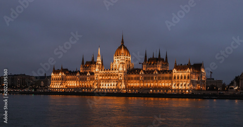 View from Buda Embankment of the Parliament building illuminated by floodlights on Pest embankment in Budapest in Hungary