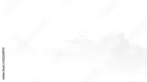 Canvas Print Clouds float across a clear sky during the afternoon in a nature scene with a tr
