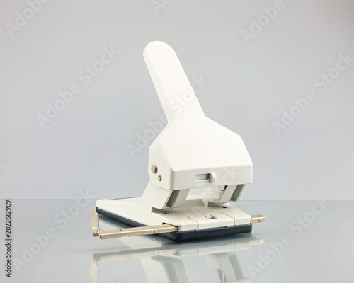Obraz na plátně Elegant white vintage paper puncher, a classic office tool