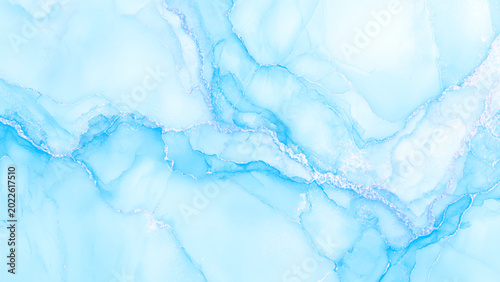 Photos Soft blue marble texture with white veins and subtle sparkle for backgrounds or