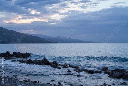 Mediterranean Sea view from Cap Martin with distant mountains and calm water, morning atmosphere