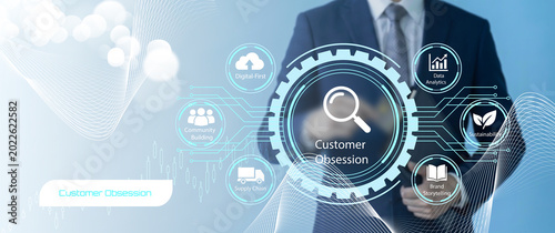 Fotografie Business professional emphasizing customer obsession with digital technology and