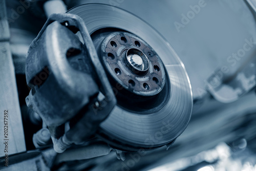 Εκτύπωση καμβά Detailed brake disc and caliper assembly on vehicle lift