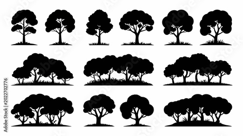 Tableau sur toile collection of twelve black tree silhouettes with grassy bases on a white backgro