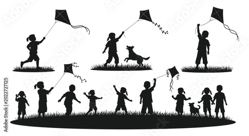 Obraz na płótnie Children flying kites in a field black silhouette