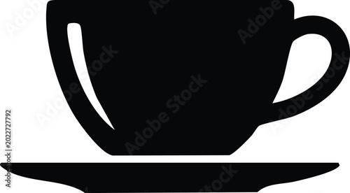 Fotografie Black coffee cup silhouette on a saucer