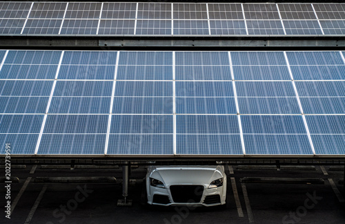 Solar cell panels have installed on the garage roof of an old private parking lot.
