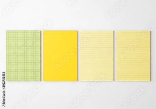 Four colorful notepads with different paper styles on a white background
