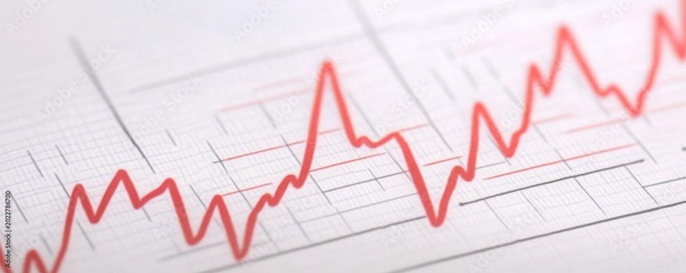 Fototapeta premium Dynamic close-up A sharp red line tracing fluctuations on white grid paper, symbolizing vital data, heart rate, or stock market trends. Visualizing progress and change. ,Analytics