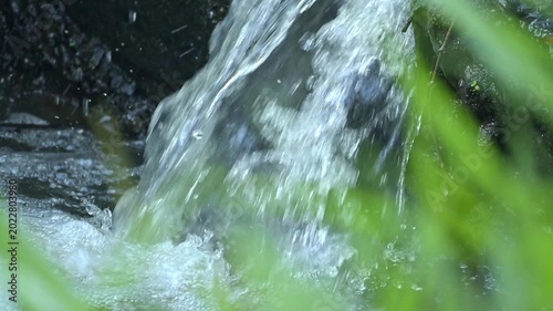 Small waterfall, a small and beautiful waterfall on a small stream in Brazil, 4k slow motion video.