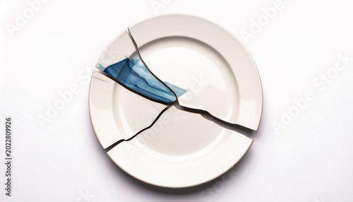 Broken Ceramic Plate with Deep Blue Fracture Accent in a Minimal Abstract Composition