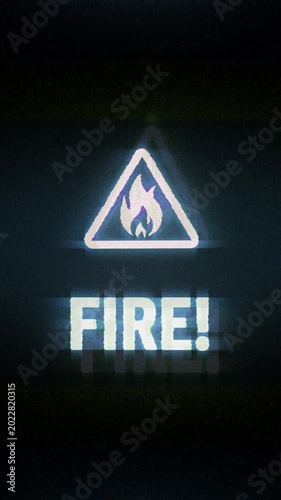 Vertical video: Fire alert symbol light flashing on screen. Flame danger warning icon on display. Loopable and seamless abstract concept with noise and modern glitch.
