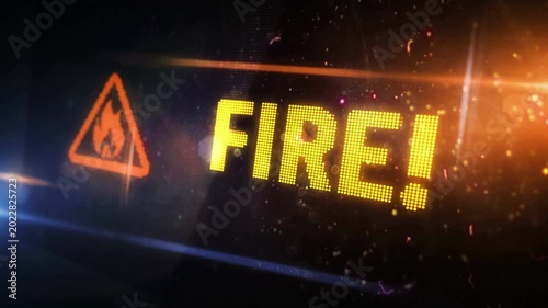 Fire alert symbol light flashing on digital display. Flame danger warning icon on pixel led screen. Close-up loopable and seamless abstract concept.
