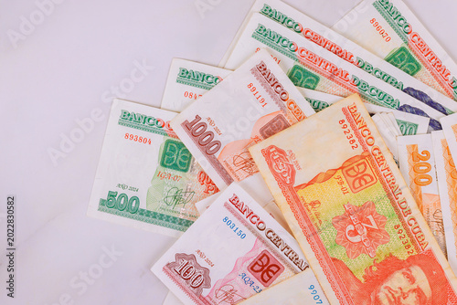 Canvas Print Cuban pesos currency banknotes CUC with different denominations arranged on back