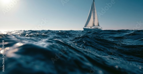 a low angle, eye level shot of a sailboat on the ocean under a bright, clear sky the horizon line is visible just above the water's surface, with the sun's glare on the left Generative AI