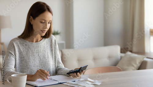 Woman working from home with laptop.