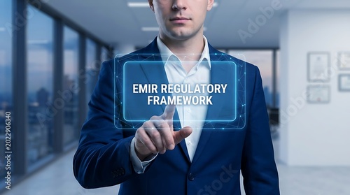 A man in a blue suit interacts with a digital interface displaying Emir Regulatory Framework in a modern office.