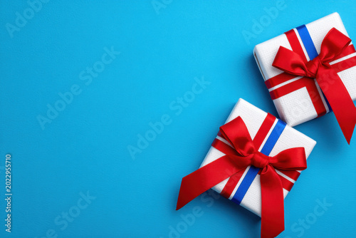 Gift box present red ribbon blue background 4th july holiday celebration copy space, festive gift box present for 4th july holiday celebration