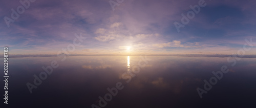 Obraz na plátne Calm Sunset Over Mirror-Like Sea Horizon With Pastel Sky Reflections — 3D Render